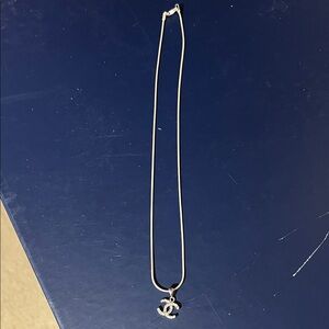 Elegant Silver Necklace with Iconic Pendant